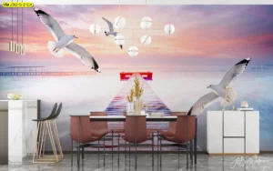 วอลเปเปอร์ภาพนก วิวนกนางนวลบินเหนือทะเลและสะพานไม้ในช่วงพระอาทิตย์ตกสำหรับตกแต่งห้องอาหารให้มีบรรยากาศเสรีภาพและความสงบเหมือนริมทะเล