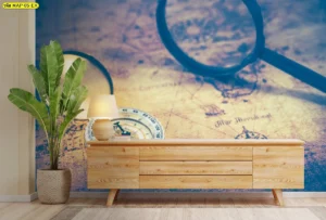 วอลเปเปอร์โฟกัสภาพเข็มทิศและแว่นขยายบนแผนที่โลกสีน้ำเงินตกแต่งผนังห้องนั่งเล่นพร้อมเฟอร์นิเจอร์ไม้สไตล์โมเดิร์น จัดแสงไฟอบอุ่น