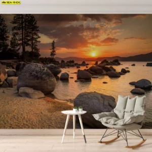 ภาพวิวพระอาทิตย์ลับฟ้า โทนอุ่นนุ่ม เหมาะกับมุมอ่านหนังสือที่ต้องการความสงบ องค์ประกอบหินและน้ำช่วยเพิ่มมิติที่ผนัง