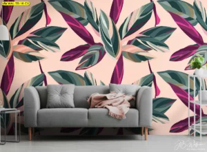 ภาพติดผนังลายใบไผ่และพืชเมืองร้อนโทนม่วงเขียวบนพื้นชมพู ห้องนั่งเล่นสไตล์ทรอปิคอลโมเดิร์นพร้อมโซฟาสีเทา