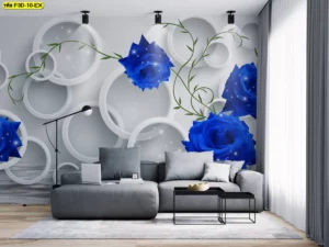 ดอกกุหลาบสีน้ำเงินบนฉากหลังวงแหวนสามมิติสีขาวเทา มอบลุคห้องรับแขกเท่แต่ยังอบอุ่นเมื่อจับคู่กับไฟโทนอุ่น เหมาะกับเจ้าของบ้านที่ต้องการจุดโฟกัสหลังโซฟา