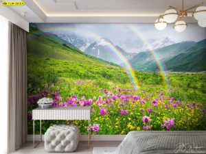 วอลเปเปอร์ภาพวิวทุ่งดอกไม้สีชมพูเหลืองบนหุบเขาเขียวพร้อมสายรุ้งคู่พาดผ่านท้องฟ้าด้านหน้าภูเขาหิมะ ตกแต่งผนังห้องนอนโฮมออฟฟิศของคนทำงานที่บ้านให้สดใสและดูมีชีวิตชีวาขึ้นทันที