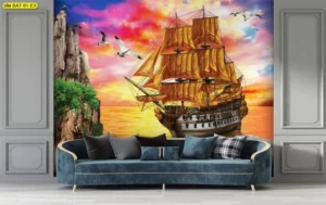 วอลเปเปอร์เรือสำเภาใบสีทองแล่นผ่านโขดหินกลางทะเลช่วงพระอาทิตย์ตกดิน ท้องฟ้าสีสดใสช่วยกระตุ้นพลังงานแห่งความสำเร็จ