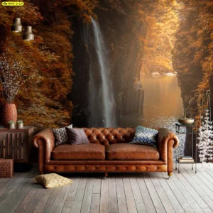 วอลเปเปอร์ลายน้ำตกท่ามกลางป่าสีส้มฤดูใบไม้ร่วง สำหรับตกแต่งผนังหลังโซฟาหนังให้ดูมีเสน่ห์และอบอุ่นแบบธรรมชาติ
