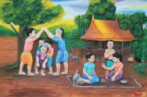 รูปติดผนังวิถีชีวิตชาวไทยโบราณ เด็กไทยเล่นรีรีข้าวสารและหมากเก็บใต้ร่มไม้ใหญ่แสดงถึงมรดกทางวัฒนธรรมอันล้ำค่า