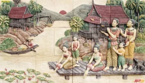 วอลเปเปอร์ลายไทยแกะสลักนูนต่ำภาพวิถีชีวิตชาวบ้านริมน้ำและครอบครัวไทยดั้งเดิมสร้างบรรยากาศอบอุ่นร่มเย็นให้ภายในบ้าน